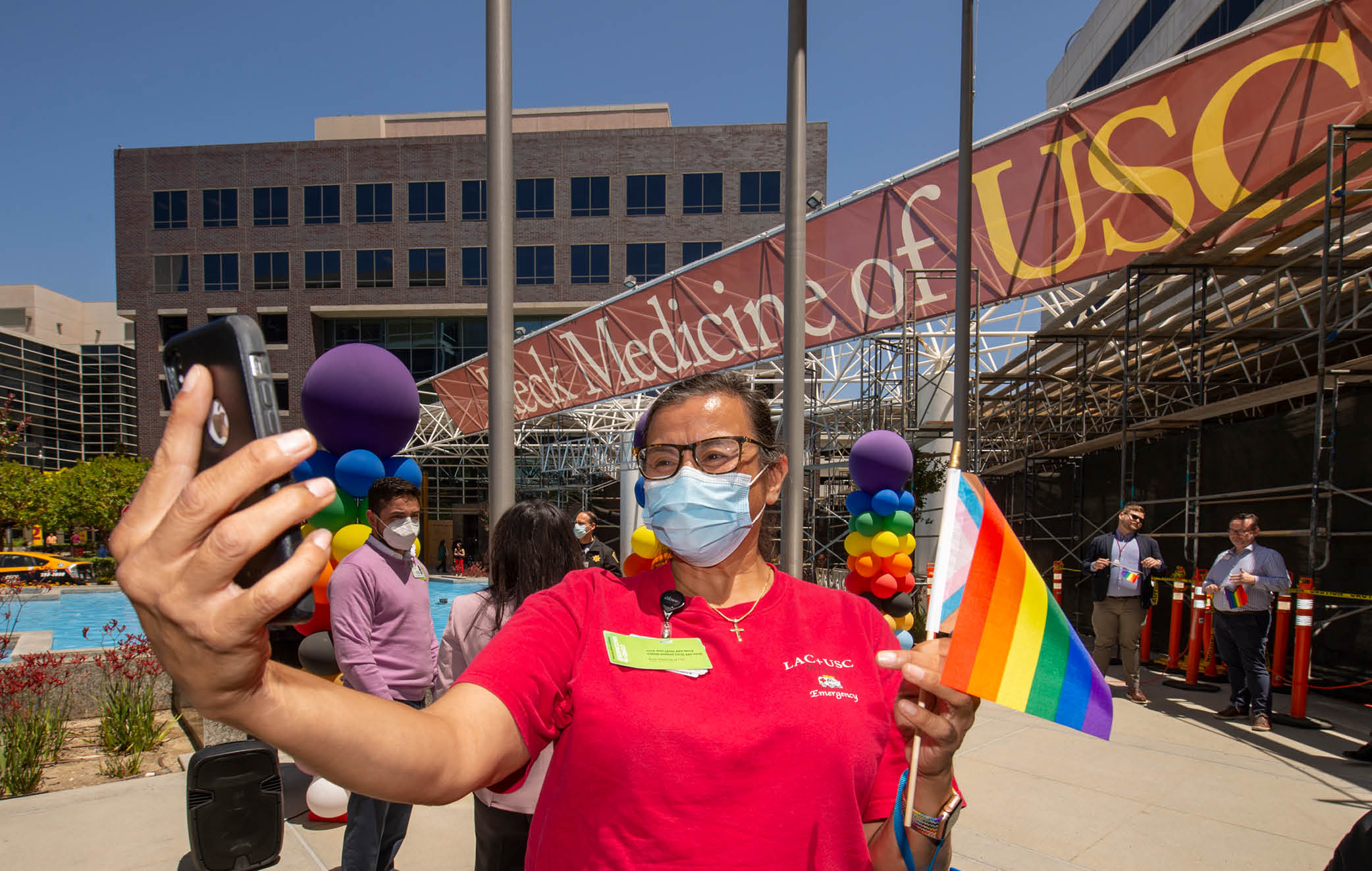 Nurse Sylvia Rodriguez takes a selfie before the raising of the Progress Pride Flag to kickoff Pride Month at Keck Medicine of USC, June 1, 2022  (Photo Gus Ruelas)  