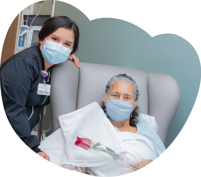 Sonnia Gutierrez receives a rose from nurse Viridiana Rosas - Mother's Day Roses 2022 - HC3 Keck Medicine of USC