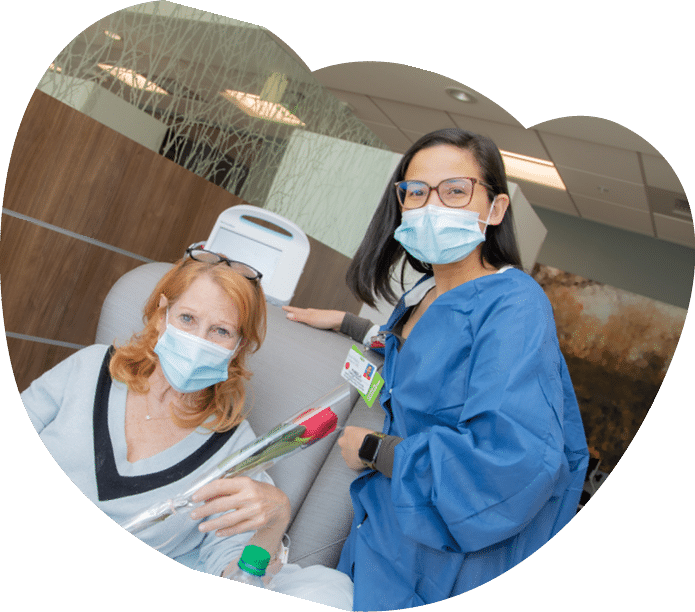 Robin Platt receives a rose from nurse Pamela French - Mother's Day Roses 2022 - HC3 Keck Medicine of USC