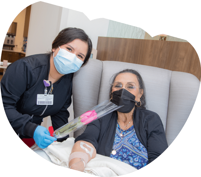  Bernice Gottermayer receives a rose from nurse Viridiana Rosas - Mother's Day Roses 2022 - HC3 Keck Medicine of USC